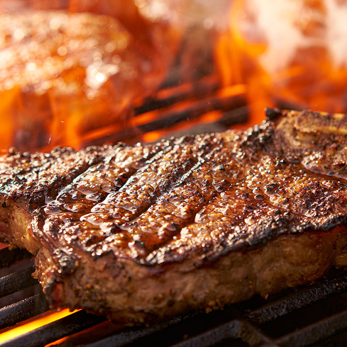 What are the benefits of using a pellet grill over a gas grill?