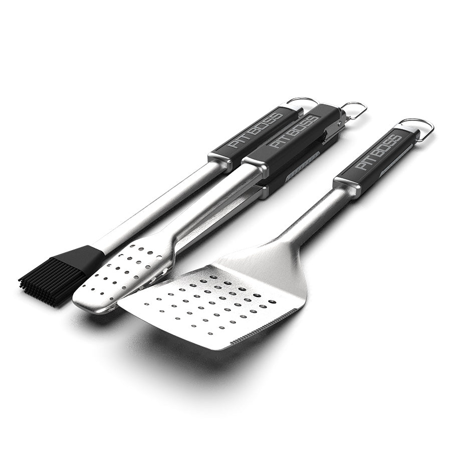 Silver Pit Boss BBQ tools set with black handles and brush.