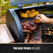 Black electric grill with two meat probes included, cooking corn, beans, and meat.
