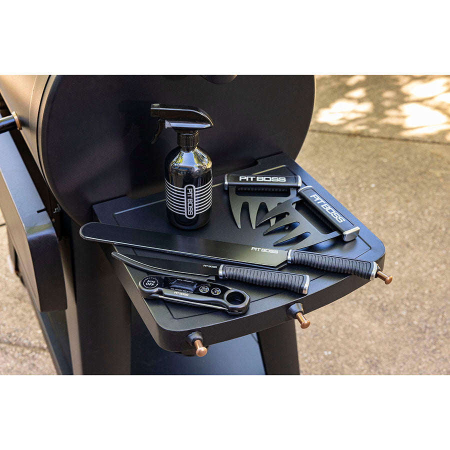 Black Pit Boss grill accessories set with cleaning tools and spray bottle.