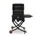 Portable black pellet grill with folding legs, side control panel, and two large wheels for easy transport.