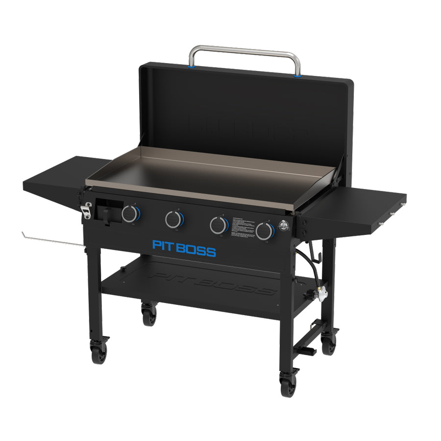 view from the side. Black griddle with both side tables out. Griddle hood open.