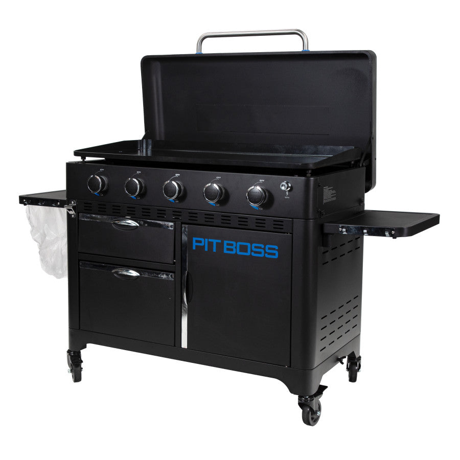 lifestyle_3, Black griddle with bright blue and silver accents with large blue "pit boss" logo. Side angle view. Grill hood open