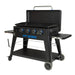 lifestyle_3, Black griddle with bright blue and silver accents and a large blue Pit Boss logo on front. Side angle view. Grill hood open