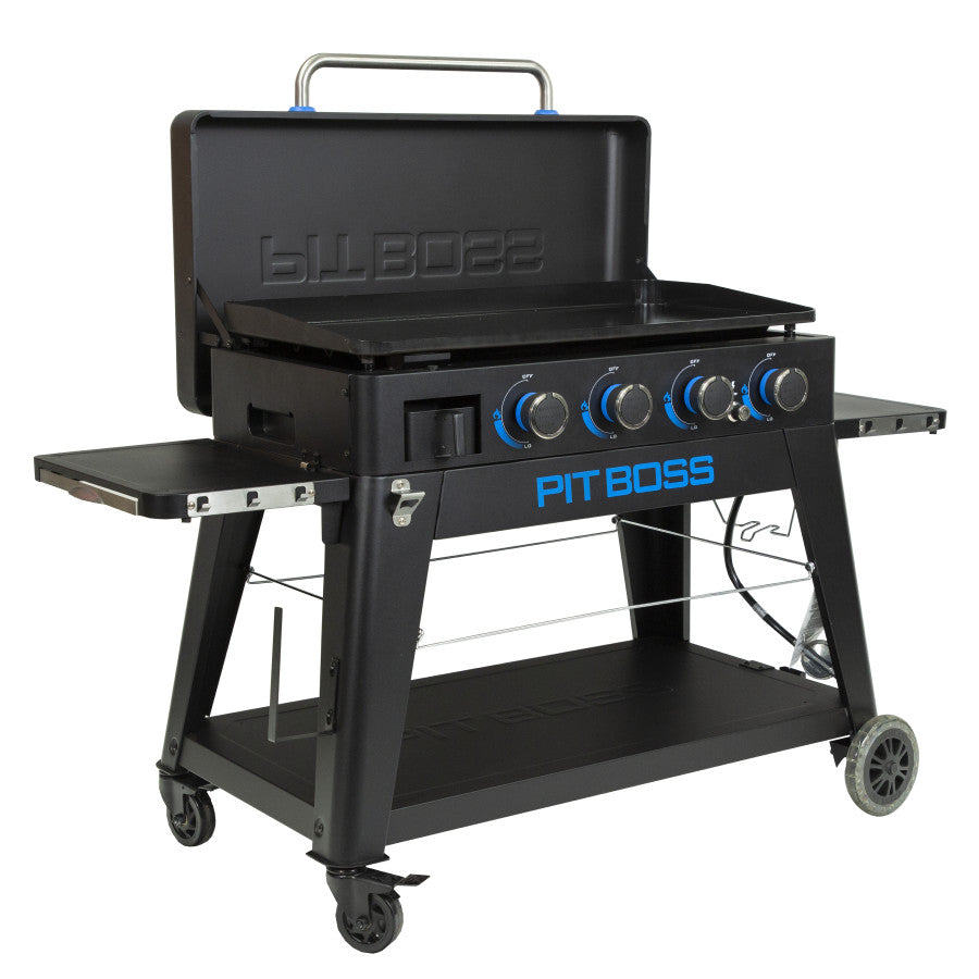 lifestyle_5, Black griddle with bright blue and silver accents and a large blue Pit Boss logo on front. Side angle view. Grill hood open