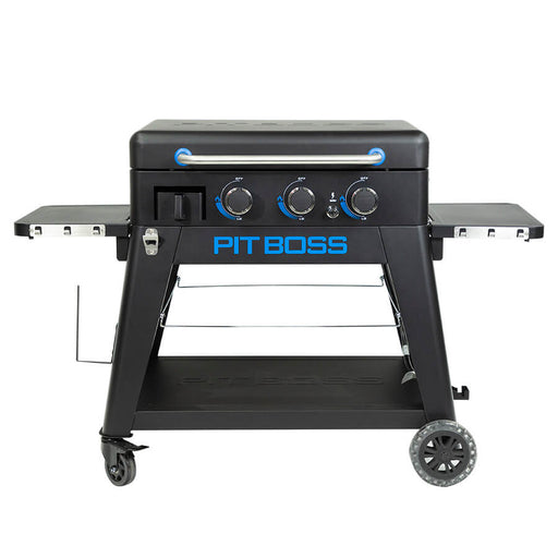 Black griddle with blue and silver accents. Large blue "Pit Boss" logo across front. Top griddle portion shown 'lifted-off' the cart for portable function