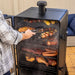 Pit Boss Sportsman 7-Series Vertical Wood Pellet Smoker, man smoking bbq food on smoker, chicken, veggies, beef