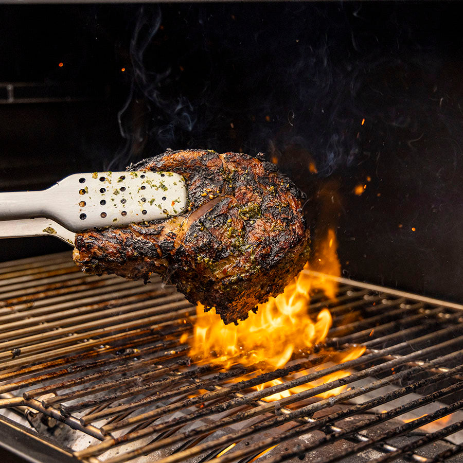 pit boss heritage wood pellet grill, direct flame sear on the grill grates with steak