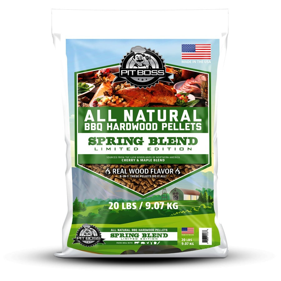 Pit Boss 20 lb Spring Blend Hardwood Pellets. Grass field background. Green and white font. Large Pit Boss logo
