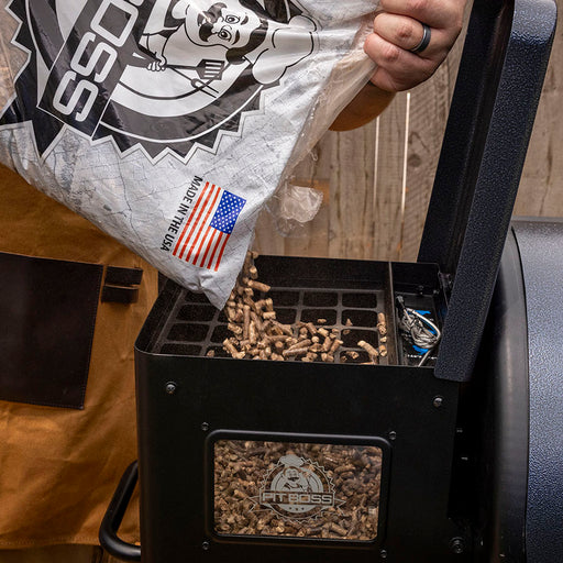 Pit Boss Hardwood BBQ Pellets Being Poured Into Wood Pellet Grill Hopper for Grilling