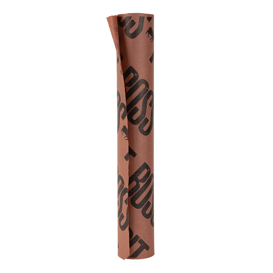 Pit Boss Butcher Paper. Red brownish paper with large black Pit Boss name logos diagonal across the whole paper.