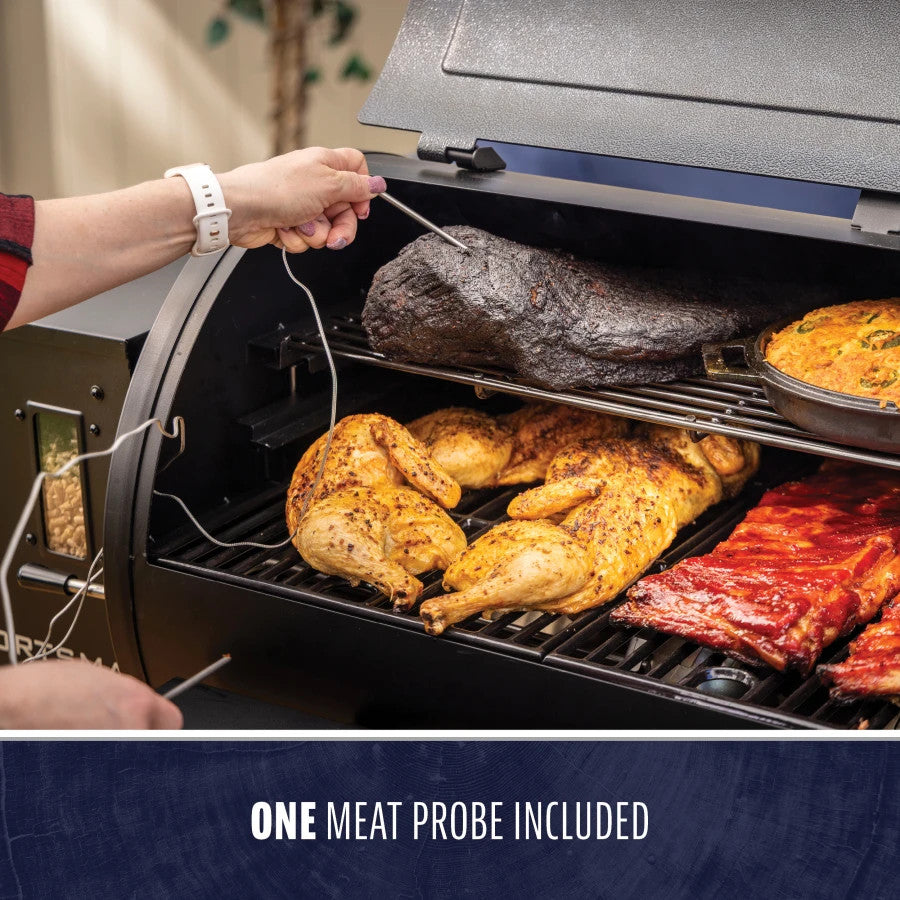 Pit Boss Sportsman Series 1100 Wood Pellet Grill with included meat probe, cooking chicken, ribs, and brisket.