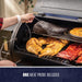 Pit Boss Sportsman Series 1100 Wood Pellet Grill with included meat probe, cooking chicken, ribs, and brisket.