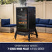 Black Pit Boss Grills Sportsman 7-Series Wood Pellet Vertical Smoker with glass door and wheels on patio.