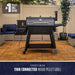 Black Pit Boss Sportsman Series 1100 Wood Pellet Grill on wheels, outdoor setting.