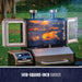 Smpoker doors open shown with meats and veggies on all three levels of the grilling rack. Grill located in a backyard.