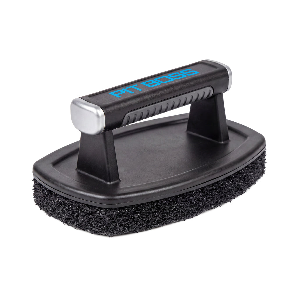 Griddle cleaning brush on griddle top.