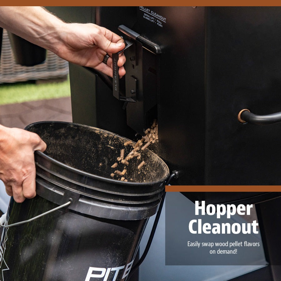 Black hopper cleanout tool emptying wood pellets into a bucket.