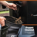 Black hopper cleanout tool emptying wood pellets into a bucket.