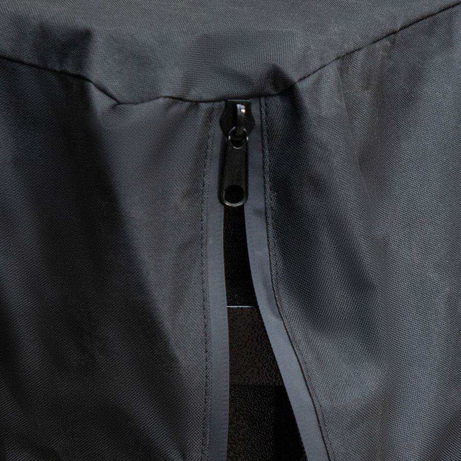 Gray jacket zipper detail, close-up view.