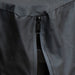 Gray jacket zipper detail, close-up view.