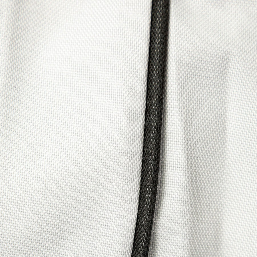 White fabric with black trim detail.