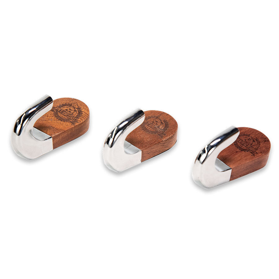 Set of three wooden and silver hooks with engraved logo.
