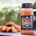 Brown Pit Boss Maple Chipotle Rub spice jar, 11 oz, outdoors with grilled food.