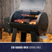 Black pellet grill with open lid, showing meats and veggies cooking. Features 518-square-inch cooking space, digital contr...