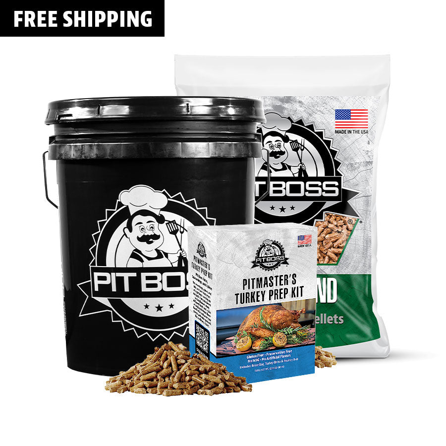 Pit Boss black bucket, white box, and bag with turkey prep kit and wood pellets.