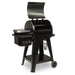 Black pellet grill with digital control panel and side shelf.