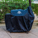 Blue Pit Boss grill cover on wheels, outdoor use.