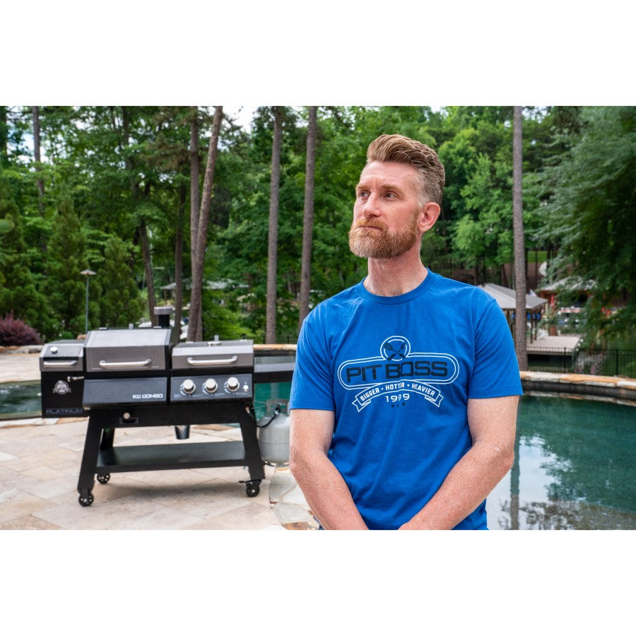 Blue Pit Boss t-shirt with "Pit Boss" logo and "Bigger, Hotter, Heavier 1979" text.