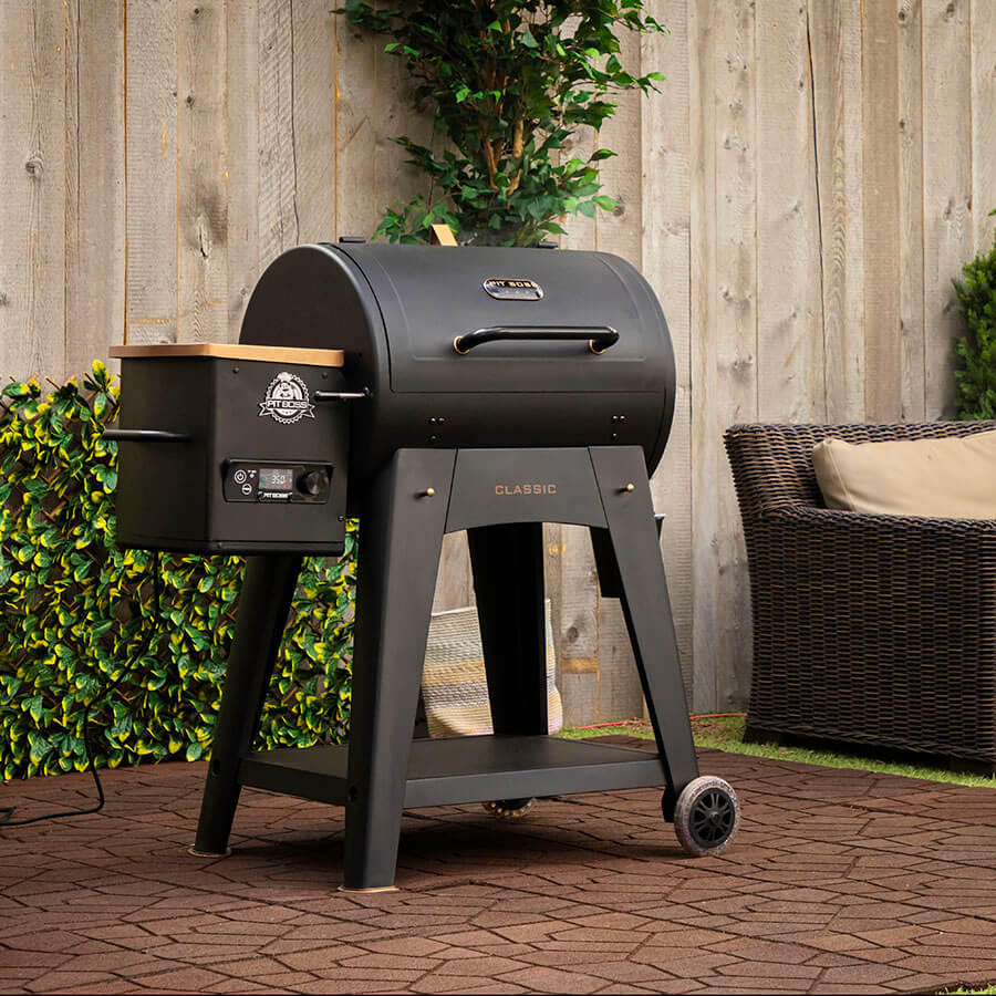 Black Pit Boss Classic pellet grill with digital control panel and wheels.