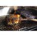 Grilled meat on black grill with flames.