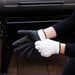 Gray touchscreen-compatible gloves with white knit wristbands.