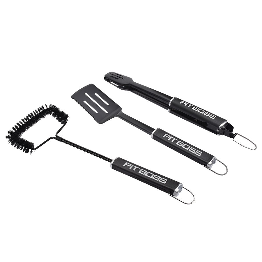 Black Pit Boss BBQ tools set: brush, spatula, and tongs.