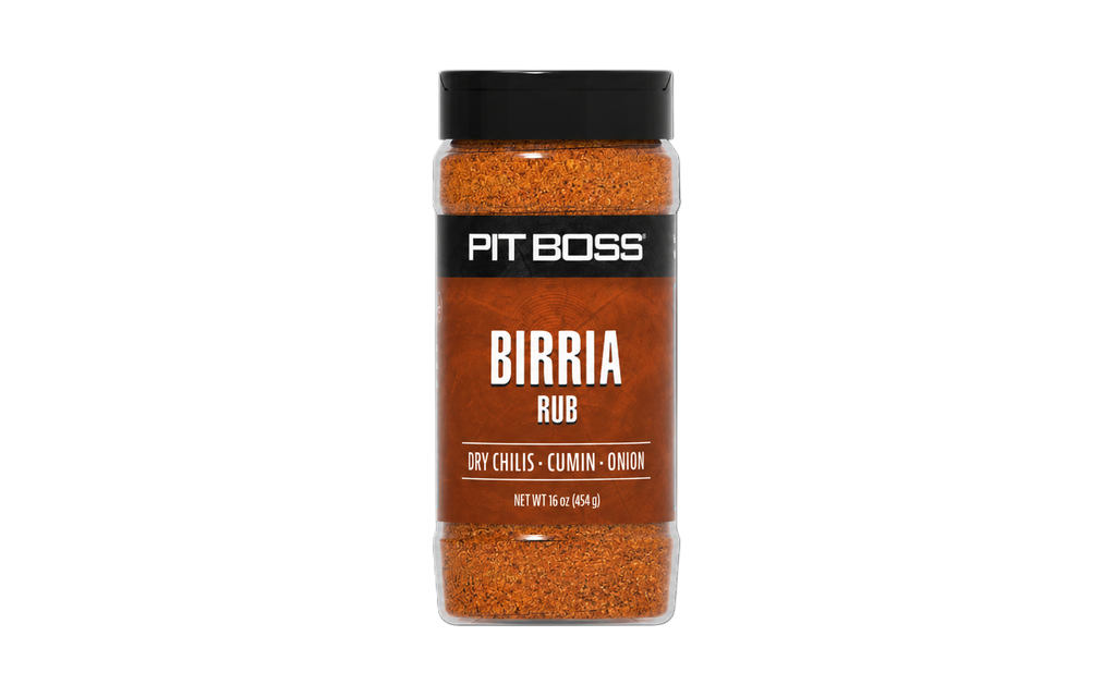 Pit Boss Birria Rub, 16 oz bottle. Orange-red spice blend with dry chilis, cumin, and onion. Black lid and label.
