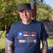 Navy blue "PIT BOSS" t-shirt with American flag design and barbecue tools graphic.