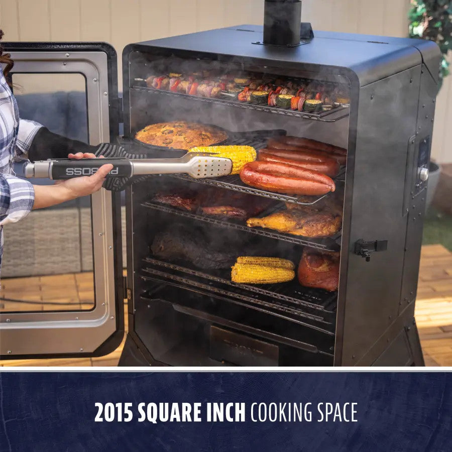 Large black vertical smoker with open door, showing multiple racks of food; labeled 2015 square inch cooking space.