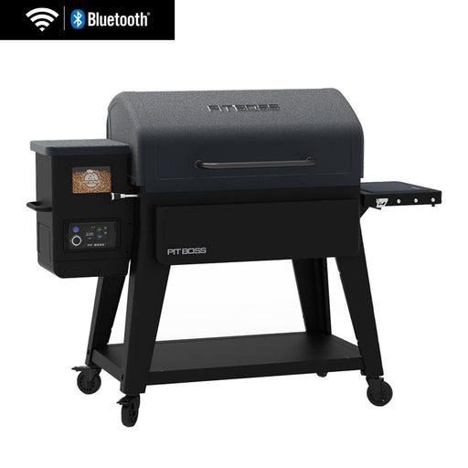 Pit Boss pellet grill with Bluetooth and Wi-Fi, black finish, side shelf, digital control panel, and caster wheels.