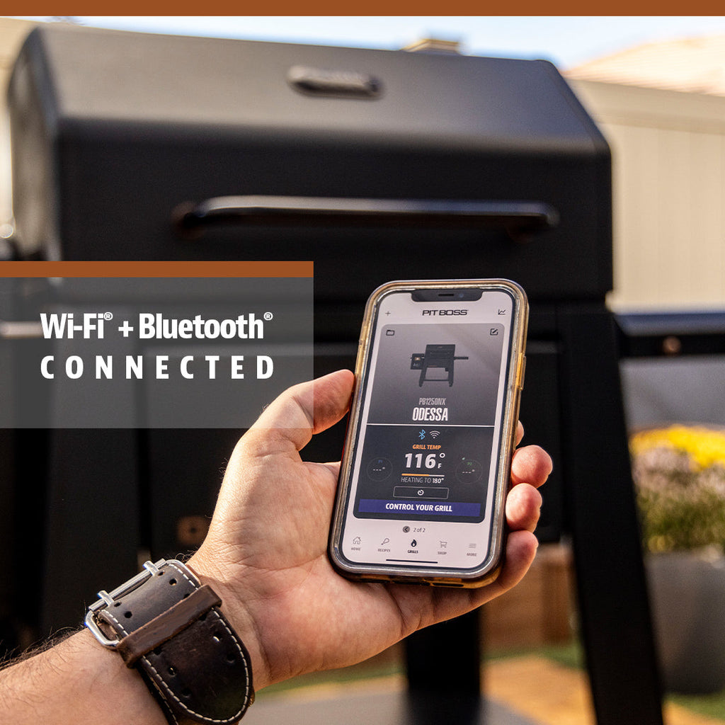 Smart black grill with Wi-Fi and Bluetooth connectivity, controlled via smartphone app.