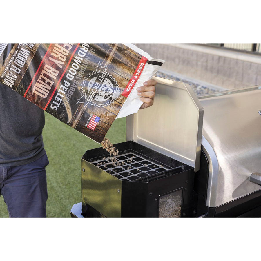 Fit Boss Cherry Blend Hardwood Pellets being poured into a grill hopper.