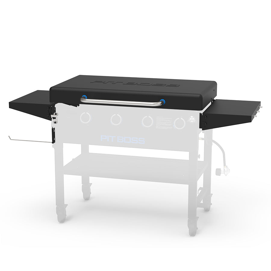 Black Pit Boss grill with side shelves and control knobs.