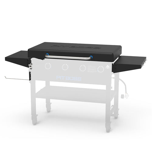 Black Pit Boss grill with side shelves and control knobs.