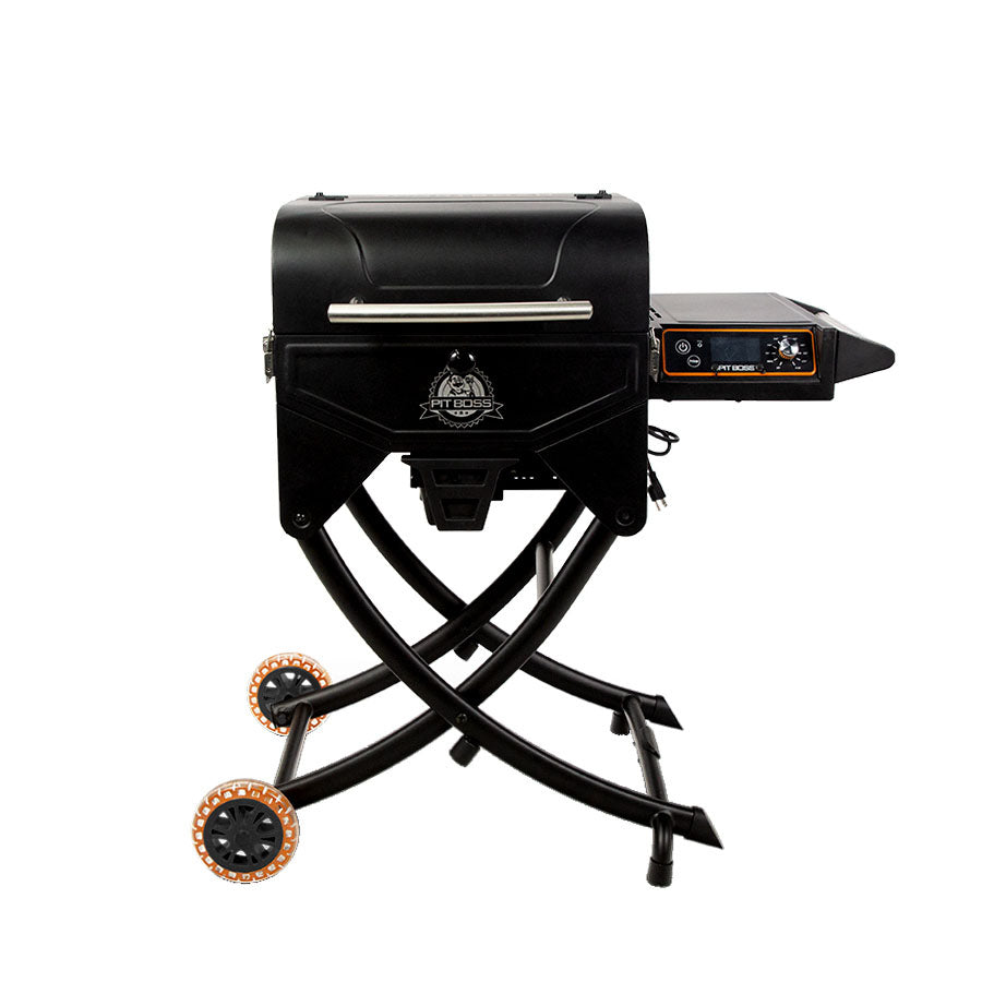 Black portable pellet grill with folding legs, control panel, and orange-accented wheels. Ideal for outdoor grilling.