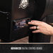 Black Pit Boss digital control board with temperature display and knobs.