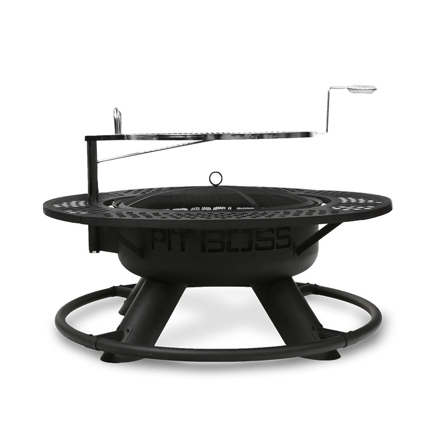 Round black metal fire pit with mesh cover and adjustable grill grate, labeled "PIT BOSS" on the side.