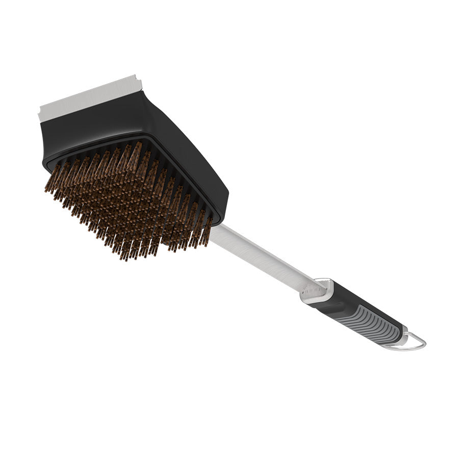 Black grill brush with metal handle and silicone bristles.