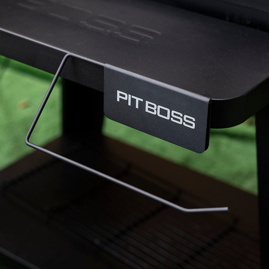 Black Pit Boss grill with branded label and wire shelf.